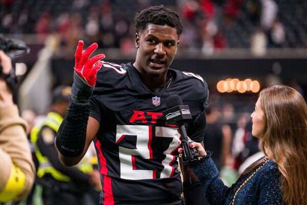 Falcons linebacker James Pearce Jr. speaks to a reporter after the team's season finale against the Saints.