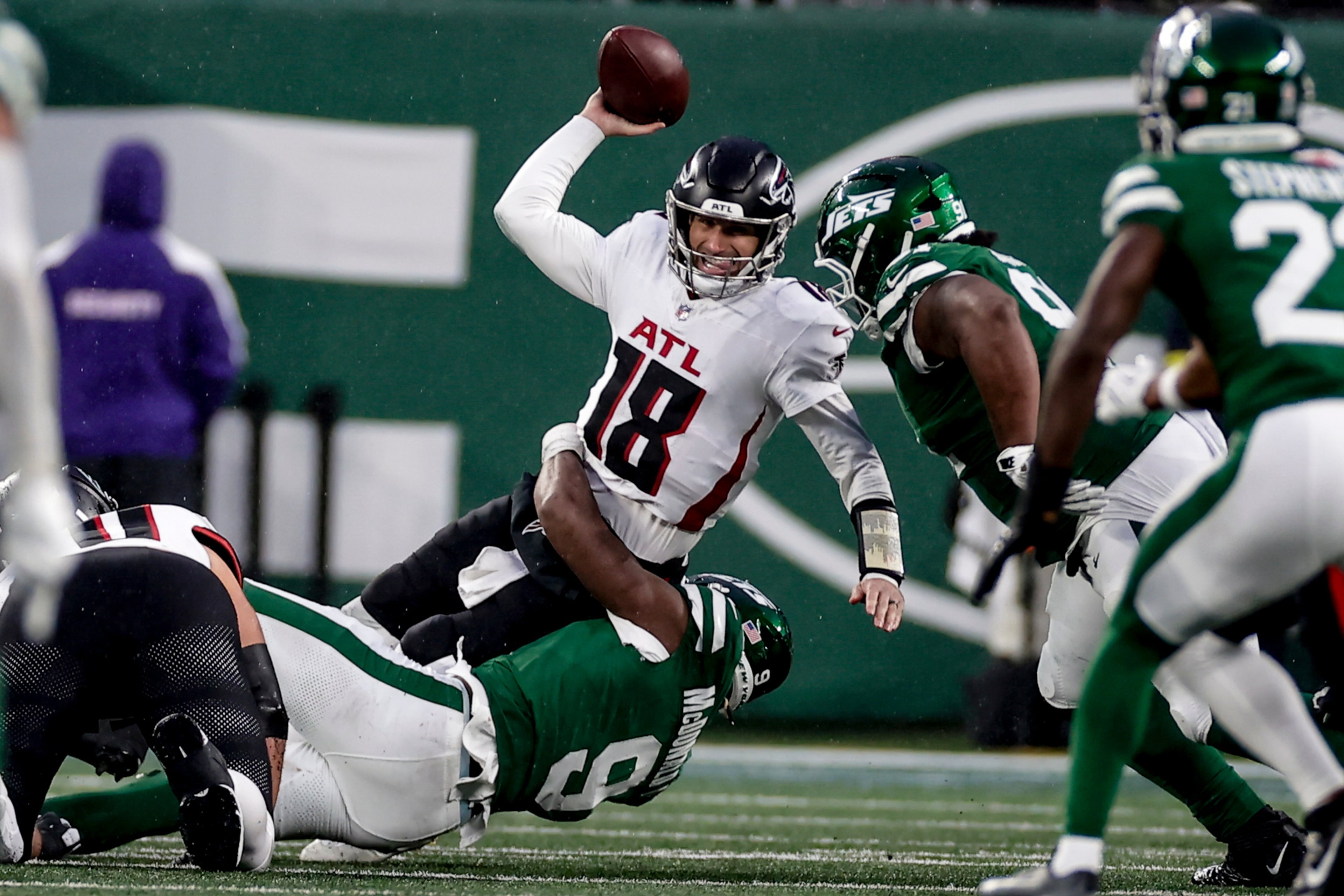Jets defensive end Will McDonald IV (bottom) sacks Falcons quarterback Kirk Cousins on Sunday.