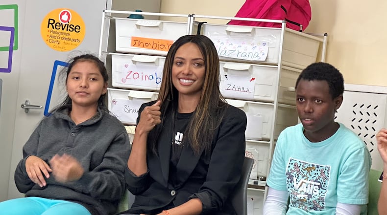 Actress Kat Graham participates in a music class at The Global Village Project for refugees in Decatur, Georgia on Sept. 12, 2023. RODNEY HO/rho@ajc.com