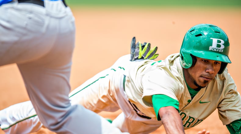 May 21, 2016 Buford - Buford's Nick Wilhite (right dives back to first base as Locust Grove's Clay Shearouse tries to pick him off during the GHSA Class AAAA Championship Baseball Tournament in Buford on Saturday, May 21, 2016. JONATHAN PHILLIPS / SPECIAL