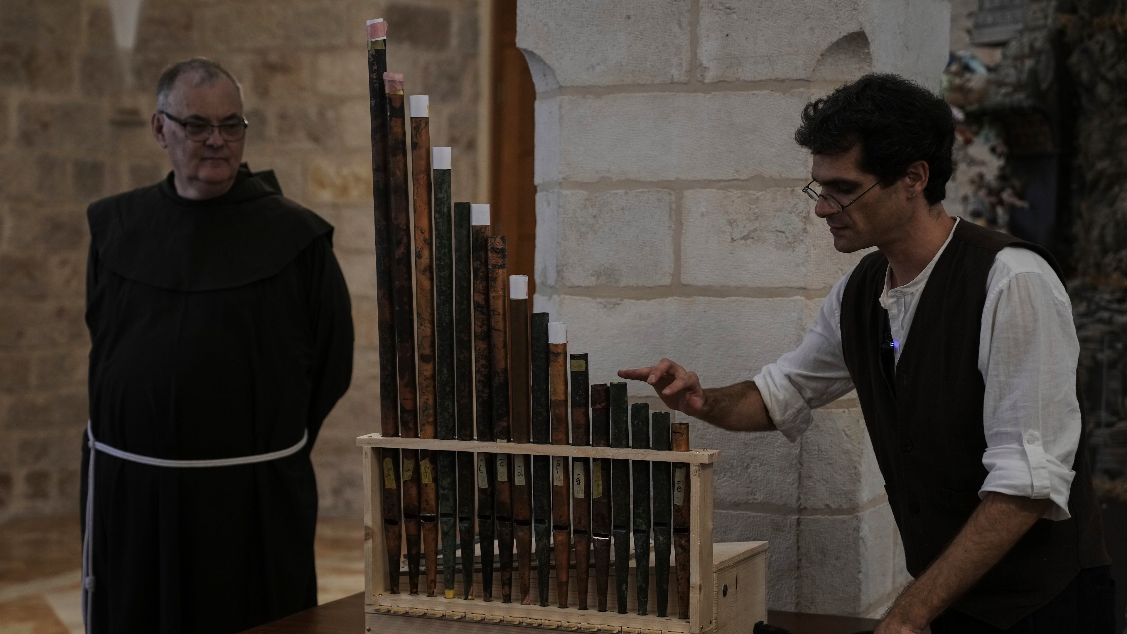 David Catalunya, a Valencian musician and musicologist displays an 11th-century organ that researchers say is the oldest in the Christian world was played for the first time in 800 years after restoration, in Saint Savior's Monastery of Jerusalem's Old City, Tuesday, Sept. 9, 2025. (AP Photo/Mahmoud Illean)