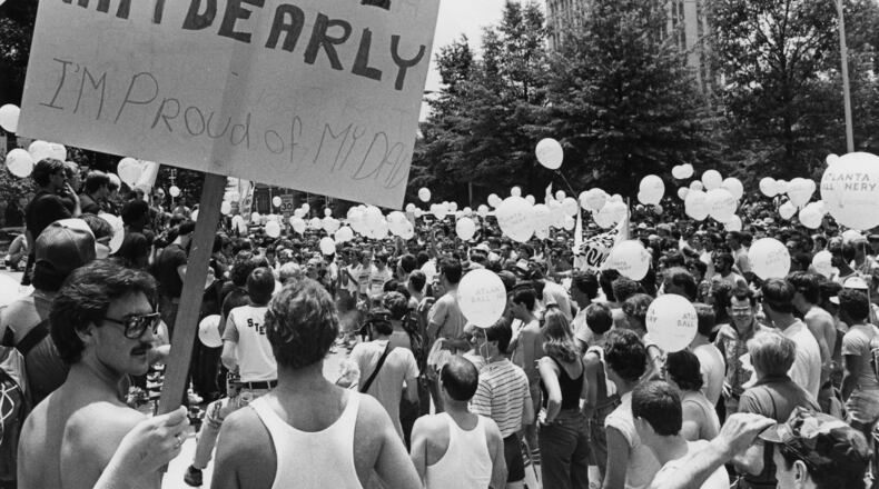 A marcher holds a sign in support of his father during a Gay Pride march and rally at the State Capitol in Atlanta on June 26, 1982. MANDATORY CREDIT: Photo credit: NANCY MANGIAFICO / THE ATLANTA JOURNAL-CONSTITUTION