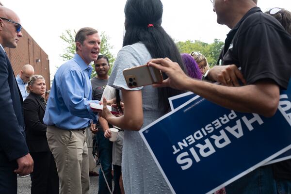 Kentucky Gov. Andy Beshear shakes hands after campaigning for Vice President Kamala Harris at a campaign event and office opening in Cumming on Sunday, July 28, 2024.   (Ben Gray / Ben@BenGray.com)