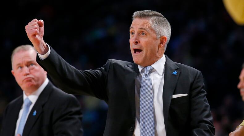 Georgia Tech coach Brian Gregory reacts during the first half of an NCAA college basketball game against Notre Dame in Atlanta, Saturday, Feb. 20, 2016. (AP Photo/Todd Kirkland)