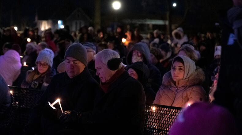 Mourners gather at a candlelight vigil for the victims of last Sunday’s parade attack, at Cutler Park in Waukesha, Wis., on Monday, Nov. 22, 2021.  The authorities in Waukesha accused Darrell E. Brooks, 39, of killing six people and wounding more than 60 others in the attack at the parade last Sunday evening. (Mary Mathis/The New York Times)
