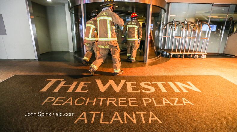 Atlanta firefighters are shown responding to a June 2020 fire at the Westin Peachtree Plaza. Crews were again called to the downtown Atlanta hotel Sunday after eight people became trapped in an elevator. (JOHN SPINK / JSPINK@AJC.COM)