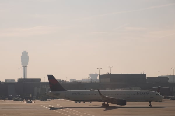 Wildfire smoke shrouds Hartsfield-Jackson Atlanta International Airport on Wednesday, April 22, 2026. The smoke even limited visibility for travelers looking out the windows as they walked through the terminals. (Ben Gray for the AJC)