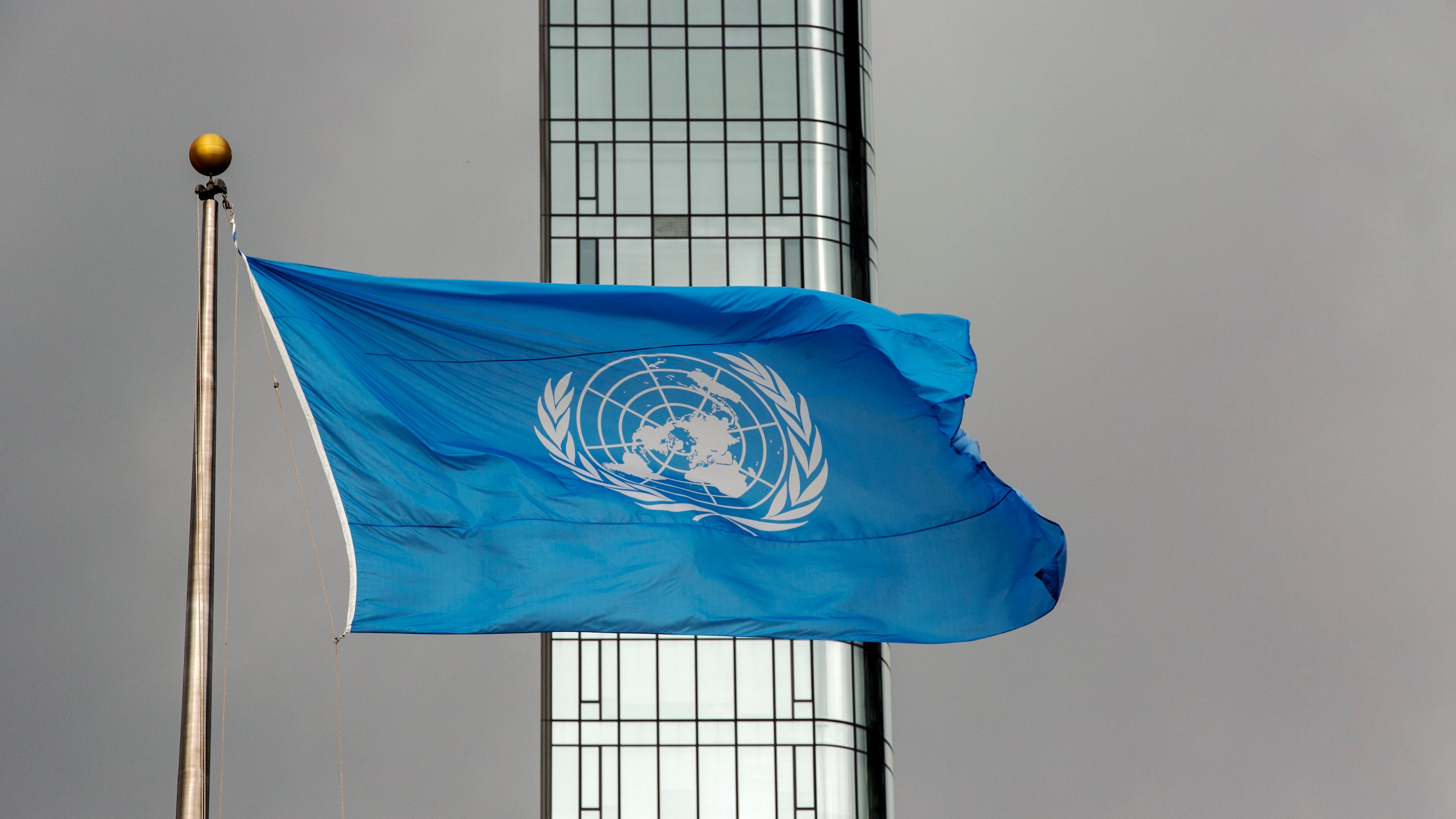 FILE - The UN flag flies on a stormy day at the United Nations during the United Nations General Assembly, Sept. 22, 2022. (AP Photo/Ted Shaffrey, File)