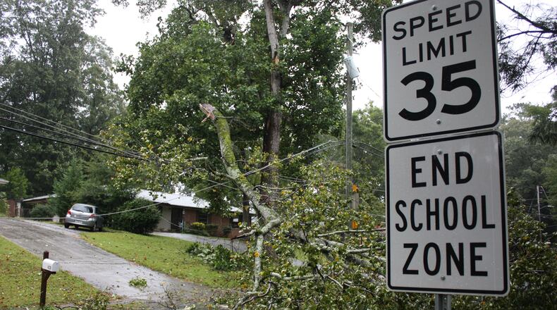 A large fallen limb knocked out power to a portion of north Dekalb County Monday afternoon, closing a section of Briarcliff Road east of Shallowford Road in the Brookdale Park neighborhood. CHRIS JOYNER / AJC