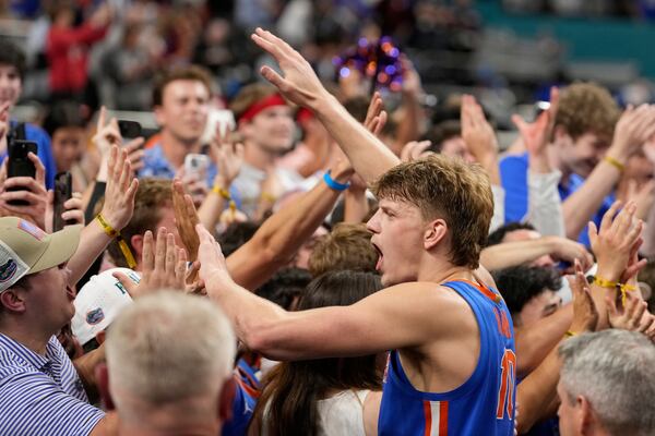Florida forward Thomas Haugh celebrates after their win against Auburn during the second half in the national semifinals at the Final Four of the NCAA college basketball tournament, Saturday, April 5, 2025, in San Antonio. (AP Photo/Brynn Anderson)