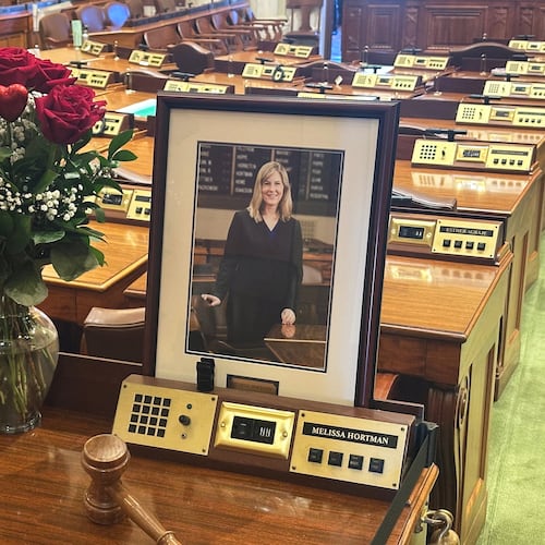 Former Minnesota House Speaker Melissa Hortman's desk sits empty in memoriam except for flowers, her portrait and a gavel in the Minnesota House chamber Wednesday, March 18, 2026, at the State Capitol in St. Paul, Minn. (AP Photo/Steve Karnowski)