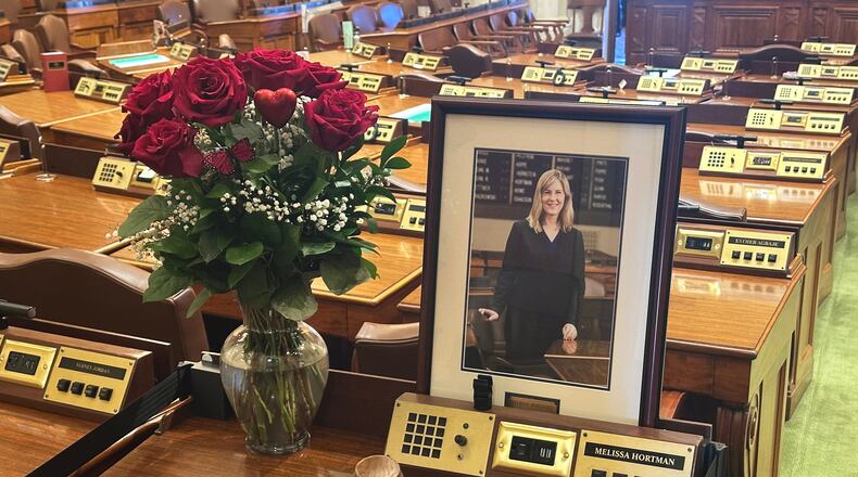 Former Minnesota House Speaker Melissa Hortman's desk sits empty in memoriam except for flowers, her portrait and a gavel in the Minnesota House chamber Wednesday, March 18, 2026, at the State Capitol in St. Paul, Minn. (AP Photo/Steve Karnowski)