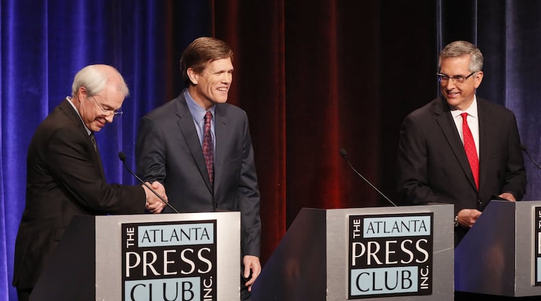 The candidates for Georgia Secretary of State shake hands after they held a debate at Georgia Public Broadcasting in Atlanta. The candidates are, from left, Democrat John Barrow, Libertarian Smythe DuVal and Republican Brad Raffensperger. The Atlanta Press Club debate will air on Georgia Public Broadcasting. BOB ANDRES / BANDRES@AJC.COM