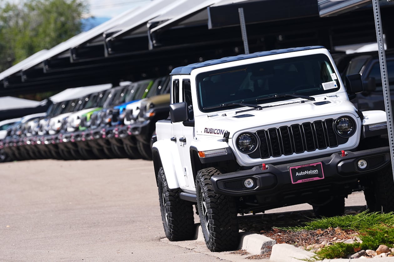 Unsold 2025 Gladiator pickup trucks sit on display outside a Jeep dealership Friday, Sept. 26, 2025, in Englewood, Colo. (David Zalubowski/AP)