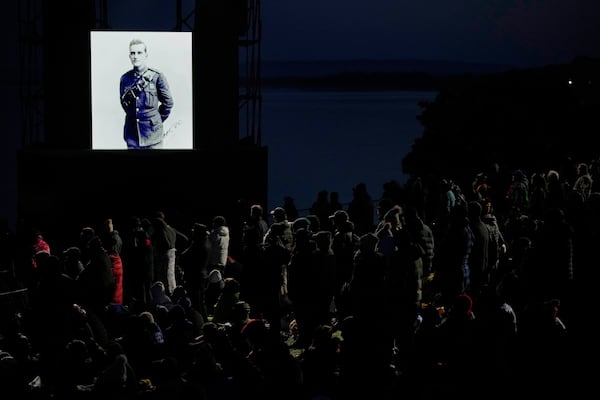 People attend the "Spirit of Place" ceremony and dawn memorial service at the Anzac Cove beach, the site of the April 25, 1915, World War I landing of the ANZAC (Australian and New Zealand Army Corps) on the Gallipoli peninsula, near Canakkale, Turkey, early Friday, April 25, 2025. (AP Photo/Emrah Gurel)