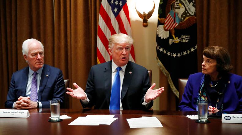 President Donald Trump speaks in the Cabinet Room of the White House, in Washington, Wednesday, Feb. 28, 2018, during a meeting with members of Congress to discuss school and community safety. (AP Photo/Carolyn Kaster)