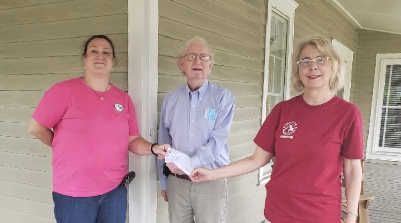 Julian Hardegree of the Union City Elks Lodge presented a grant check to Fayette Humane Society officers Stephanie Cohran and Sharon Marchisello. Courtesy FHS