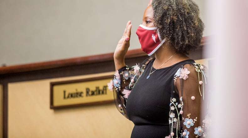 Tarece Johnson is sworn in to the Gwinnett County Board of Education on Dec. 17, 2020. Johnson was elected board chair for 2022.  (Jenni Girtman for The Atlanta Journal-Constitution)