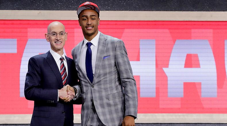 John Collins poses with NBA Commissioner Adam Silver after being selected by the Atlanta Hawks as the 19th pick overall during the NBA basketball draft, Thursday, June 22, 2017, in New York. (AP Photo/Frank Franklin II)