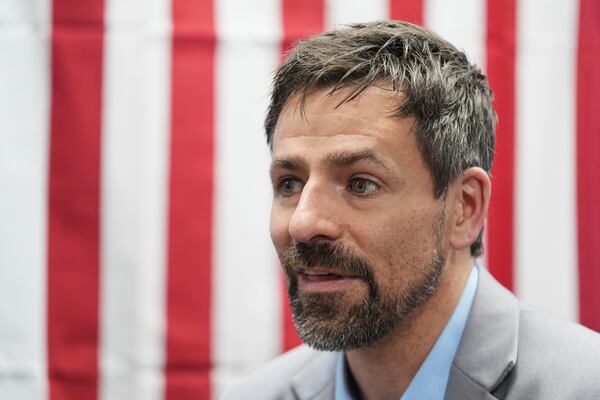 Ryan Kelley talks with attendees after speaking at the Jackson County Republican Party headquarters, Thursday, April 10, 2025, in Jackson, Mich. (AP Photo/Paul Sancya)