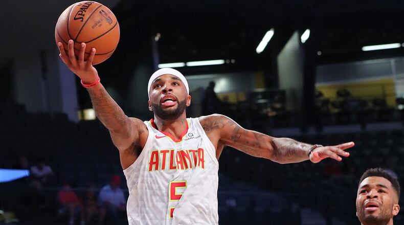 Hawks Malcolm Delaney goes to the basket against the Grizzlies.   Curtis Compton/ccompton@ajc.com