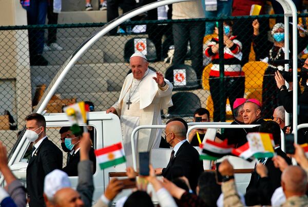 FILE - Pope Francis waves as he arrives for an open air Mass at a stadium in Irbil, Iraq, March 7, 2021. (AP Photo/Hadi Mizban, file)