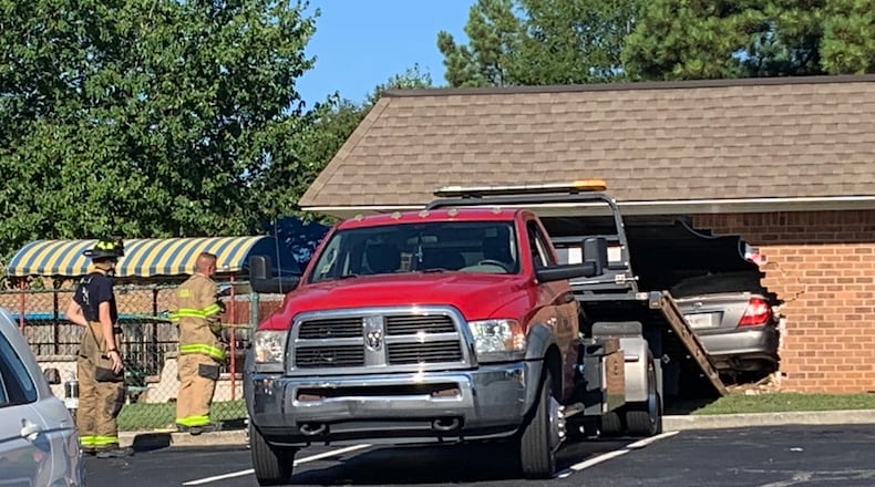 A parent lost control of her car and drove through a Riverdale day care Friday morning, authorities said.