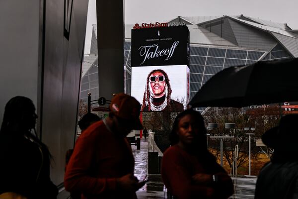 Fans wait outside of State Farm Arena to attend the memorial service for Migos rapper Takeoff on Friday, Nov. 11, 2022. (Natrice Miller/AJC)