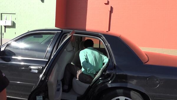 Dr. José A. Rios sits handcuffed after being arrested in November 2015 at the clinic where he worked off Buford Highway. The DeKalb County Solicitor-General’s Office has yet to file a formal accusation launching the criminal trial process, and the clock is ticking on the two-year statute of limitations. MUNDO HISPANICO
