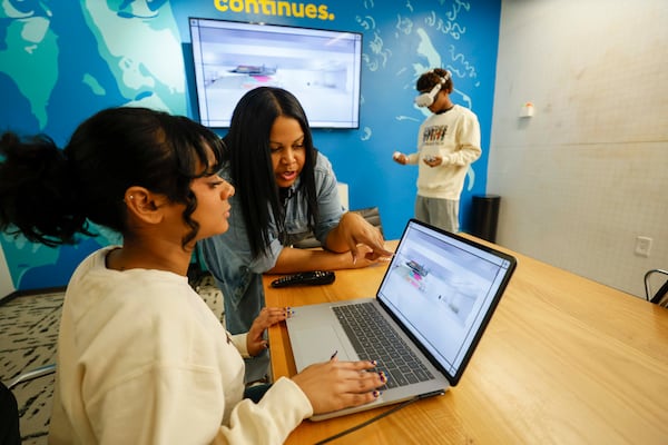 Shana Sanders (right), founder and CEO of We Create Tech, helps Georgia State University student Natasha Narine during a virtual reality program class at Plywood Place on Sept. 15, 2025. (Miguel Martinez/AJC)