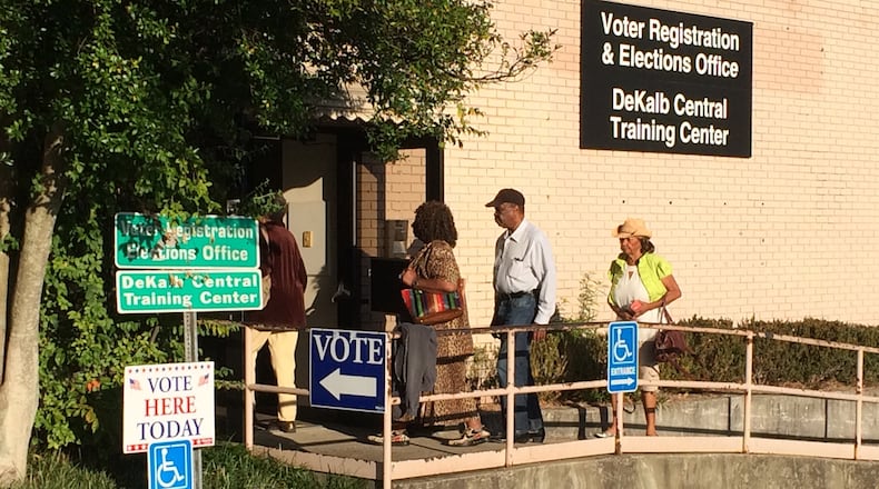 Voters walk in The DeKalb County Voter Registration and Elections Office off Memorial Drive on Monday morning as early voting begins. JOSHUA SHARPE/JOSHUA.SHARPE@AJC.COM