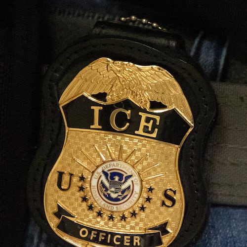 FILE - A federal agent wears an Immigration and Customs Enforcement badge in New York, June 10, 2025. (AP Photo/Yuki Iwamura, File)