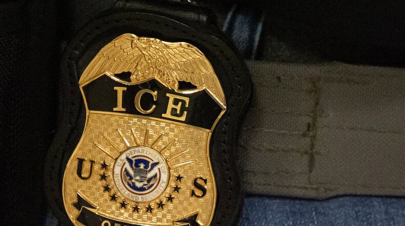 FILE - A federal agent wears an Immigration and Customs Enforcement badge in New York, June 10, 2025. (AP Photo/Yuki Iwamura, File)