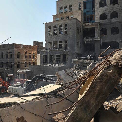FILE - Workers use heavy machinery to clear rubble from buildings destroyed in an Israeli airstrike in Sanaa, Yemen, on Sept. 13, 2025. (AP Photo/Osamah Abdulrahman, File)