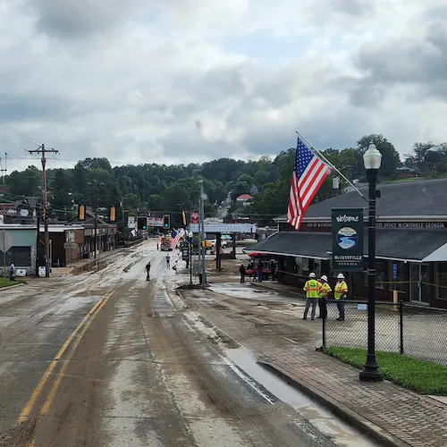 City and county crews and residents in McCaysville clean up streets and repair roads and buildings on Sunday, Aug. 2, 2026, after heavy rainfall overnight led to flooding in the North Georgia small town. (Courtesy of Fannin County Fire Department)