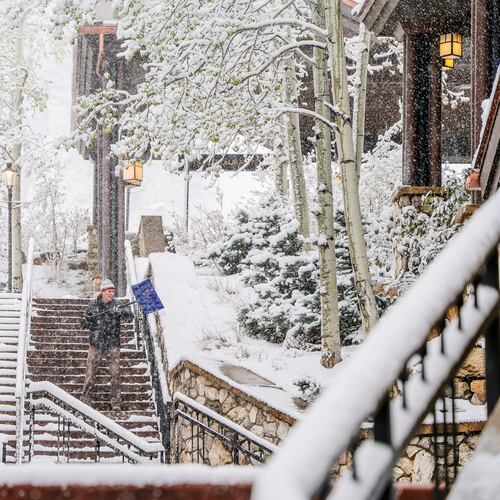 Chris Osborne shovels snow Wednesday, May 6, in Beaver Creek, Colo. (Chris Dillmann/Vail Daily via AP)