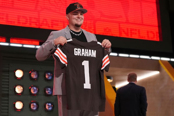 Michigan defensive lineman Mason Graham poses after being chosen by the Cleveland Browns with the fifth overall pick during the first round of the NFL football draft, Thursday, April 24, 2025, in Green Bay, Wis. (AP Photo/Jeff Roberson)
