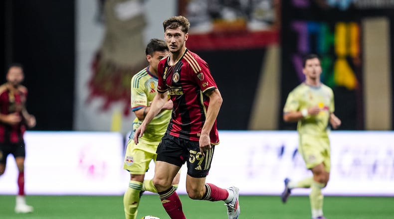 Atlanta United midfielder Alexey Miranchuk #59 dribbles the ball during the match against the New York Red Bulls at Mercedes-Benz Stadium in Atlanta, GA on Saturday October 5, 2024. (Photo by Mitch Martin/Atlanta United)