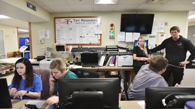 Emergency Room staff work at Tift Regional Medical Center's Emergency Center in Tifton, Ga. on Wednesday, March 13, 2019. Hospitals are required by federal law to treat any patient who walks into an emergency room, so the ER must be fully staffed at all times. Tift is building programs to attract more well-insured patients. Other rural hospitals face of dearth of insured patients. HYOSUB SHIN / HSHIN@AJC.COM