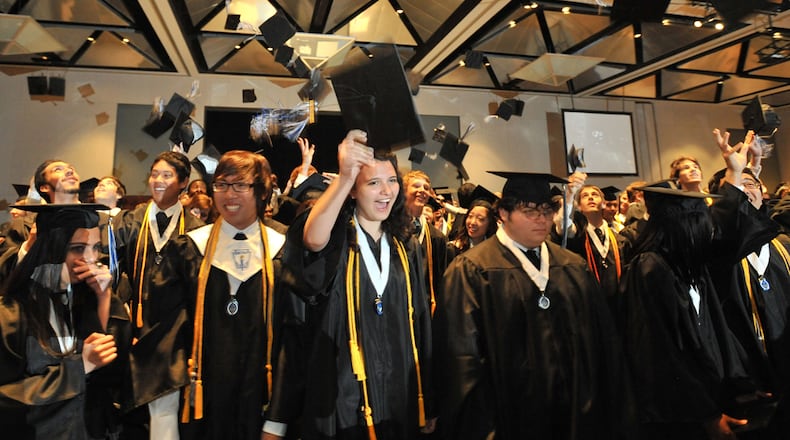 Students of the Gwinnett School of Mathematics, Science and Technology celebrate graduation in this AJC file photo.