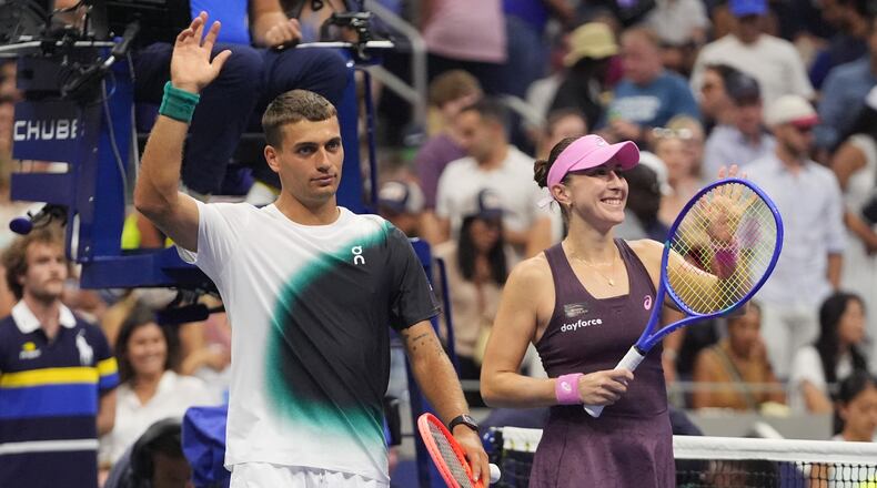 Belinda Bencic, of Switzerland, and Flavio Cobolli, of Italy, left, celebrate after defeating Elina Svitolina, of Ukraine, and Gael Monfils, of France, in a mixed doubles semifinal match at the U.S. Open tennis championships Wednesday, Aug. 26, 2026, in New York. (AP Photo/Frank Franklin II)