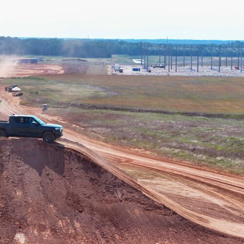 An aerial image shows a Rivian pickup truck on top of a dirt mound during a demonstration after the groundbreaking ceremony on Tuesday, Sept. 16, 2025, in Walton and Morgan Counties.
(Miguel Martinez/ AJC)