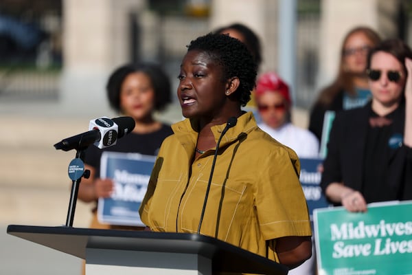Midwife Tamara Taitt, executive director of Atlanta Birth Center, speaks during a news conference last month to announce a lawsuit. (Jason Getz/AJC)