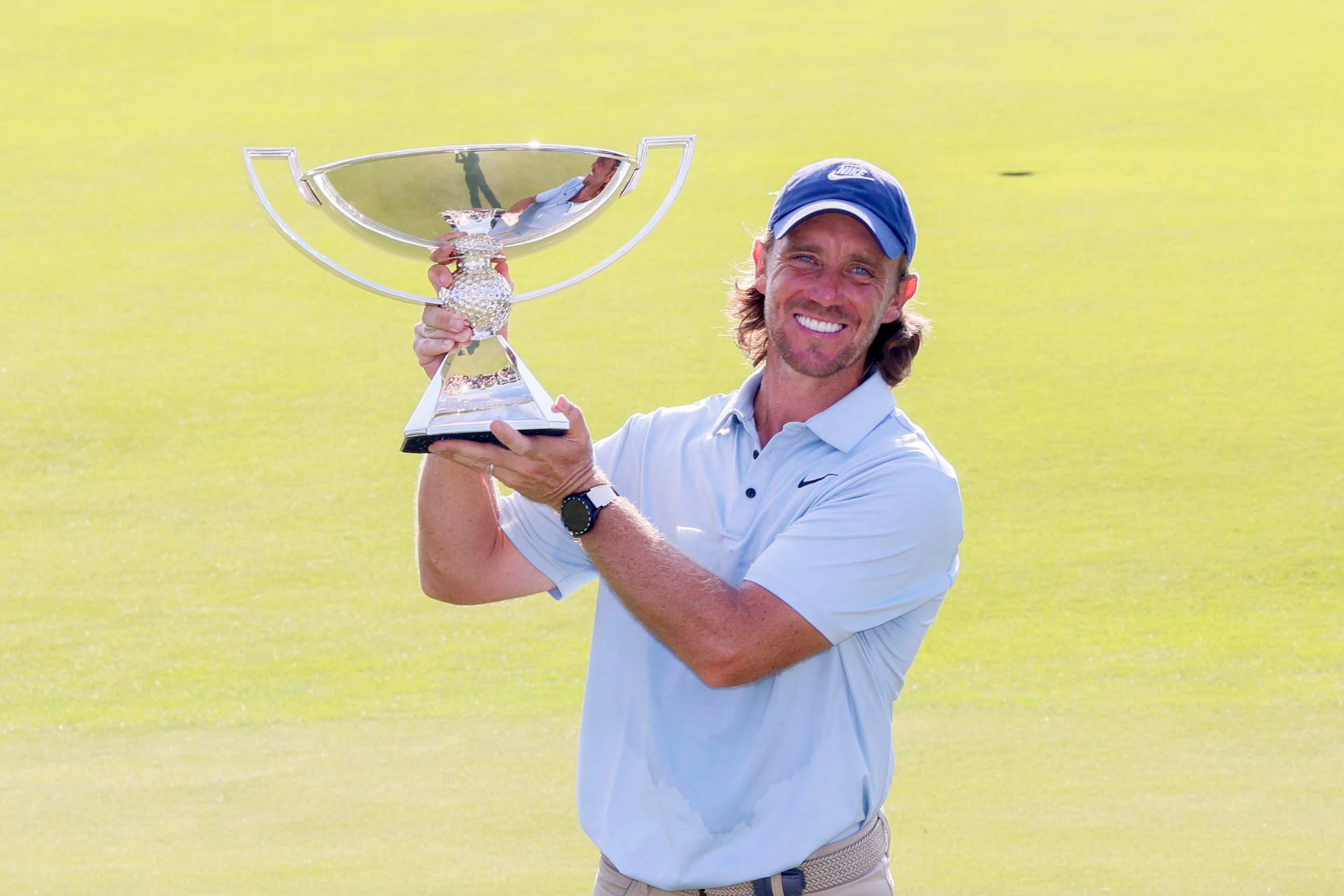 Tommy Fleetwood, from England, poses for the media as he holds the PGA Tour Championship trophy at East Lake Golf Club on Sunday, Aug. 24, 2025, in Atlanta.(Miguel Martinez/ AJC)