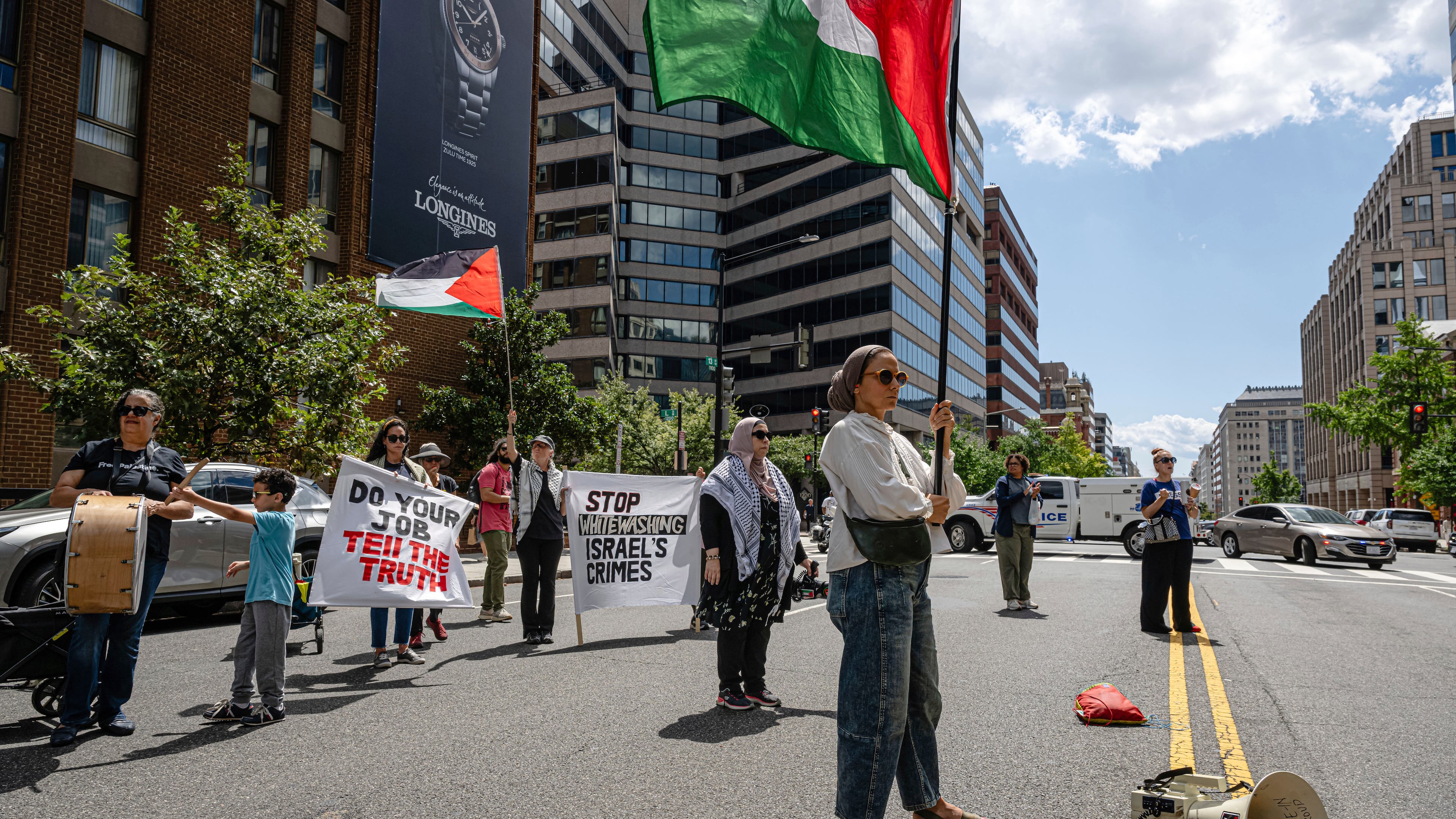 Pro-Palestinian demonstrators gather for a protest in front of the Associated Press offices, Thursday, Aug. 28, 2025, in Washington. (AP Photo/Jon Cherry)