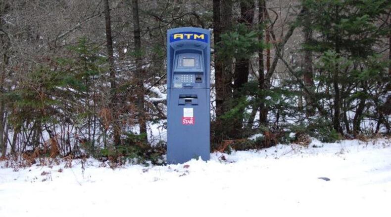 An Atm found in the snowy woods of southern Maine was put there as a joke, authorities said.