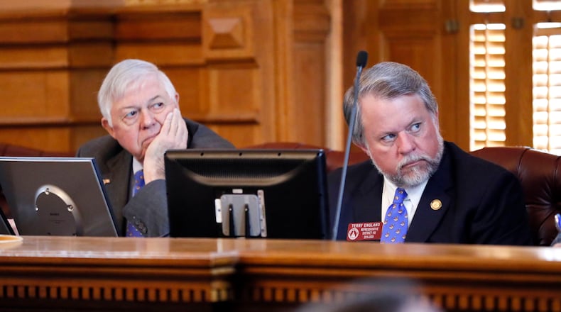 Sen. Jack Hill, R-Reidsville, (left) and Rep. Terry England, R-Auburn, chairmen of the Legislature’s budget committees, listen as Georgia Gov. Brian Kemp talks about his budget plans in 2019. Bob Andres / bandres@ajc.com