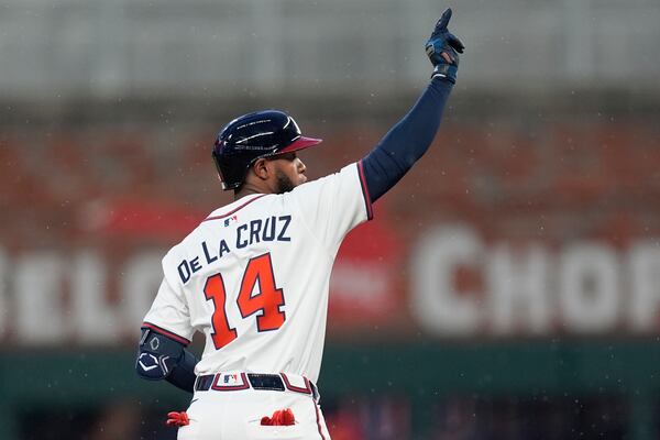 Atlanta Braves' Bryan De La Cruz (14) celebrates his double against the Philadelphia Phillies in the second inning of a baseball game, Thursday, April 10, 2025, in Atlanta. (AP Photo/Mike Stewart)