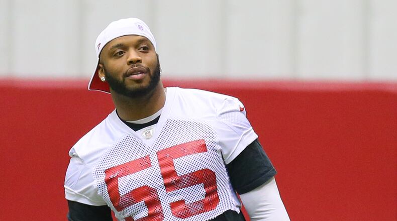 Falcons defensive end John Abraham watches from the sidelines between drills during team practice at Flowery Branch on Wednesday, Jan. 16, 2013. CURTIS COMPTON / CCOMPTON@AJC.COM