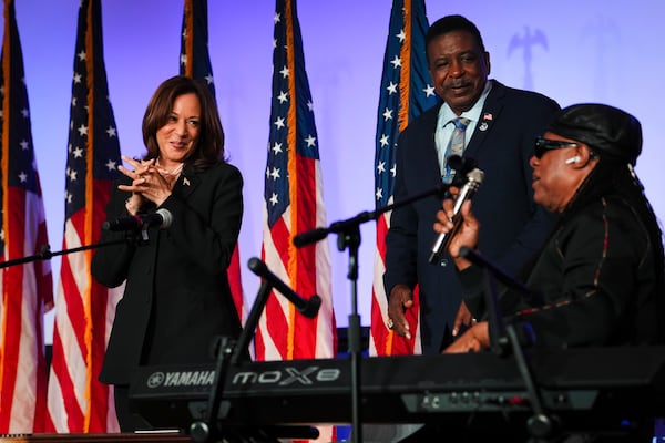 Musician Stevie Wonder (right) sings "Happy Birthday" to then-Vice President Kamala Harris during her presidential campaign event in Jonesboro last year. (Erin Schaff/The New York Times)
                      